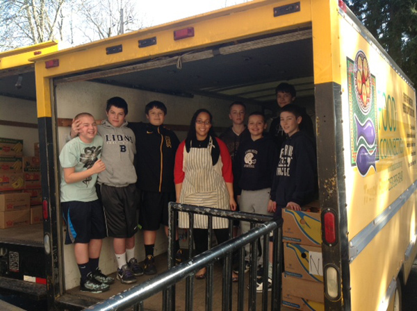 7th graders help out St. Leo's Food Connection.